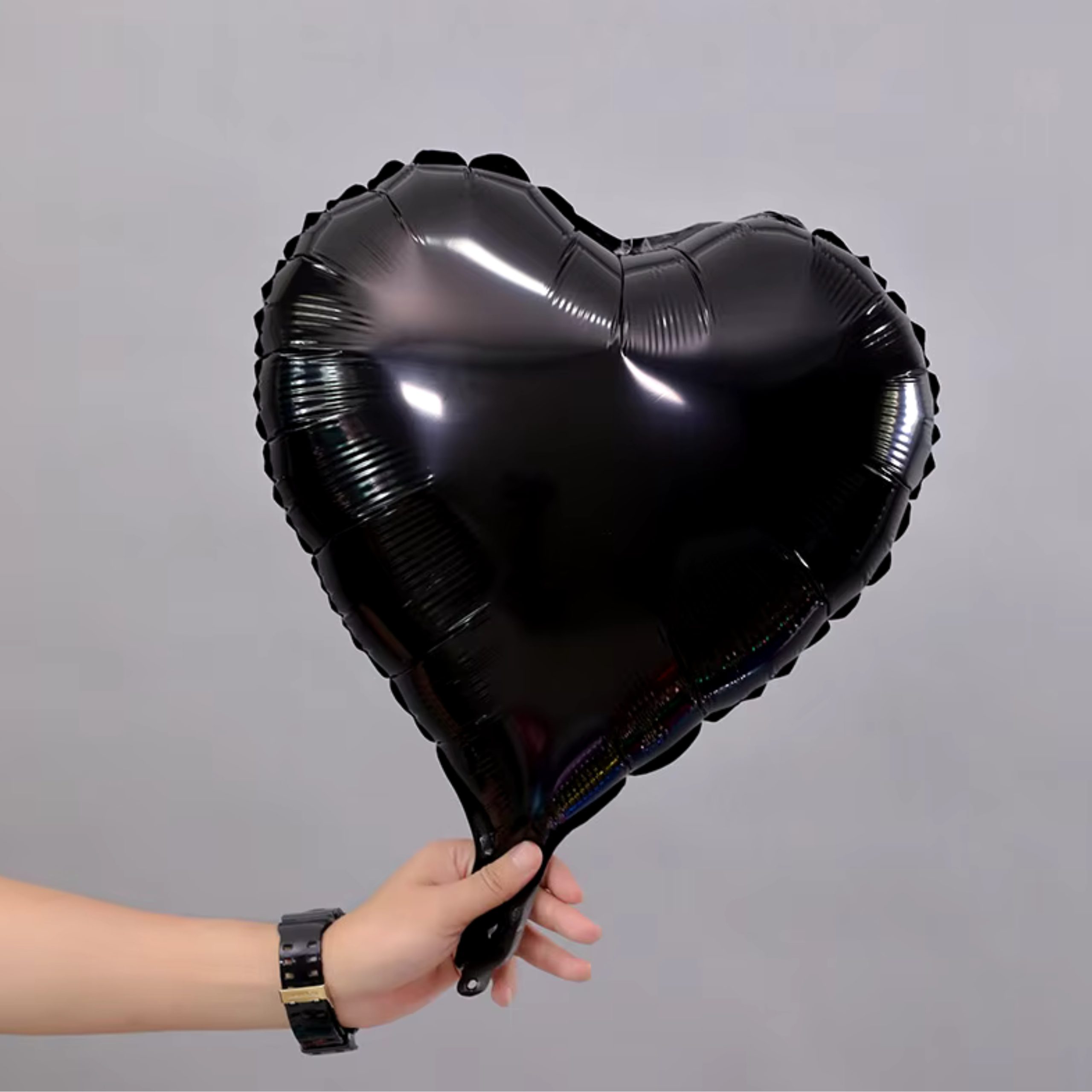 b-31-scaled-1.jpg 18" Black Heart Shape Metallic Foil Balloon (Unpacked) - Image 1